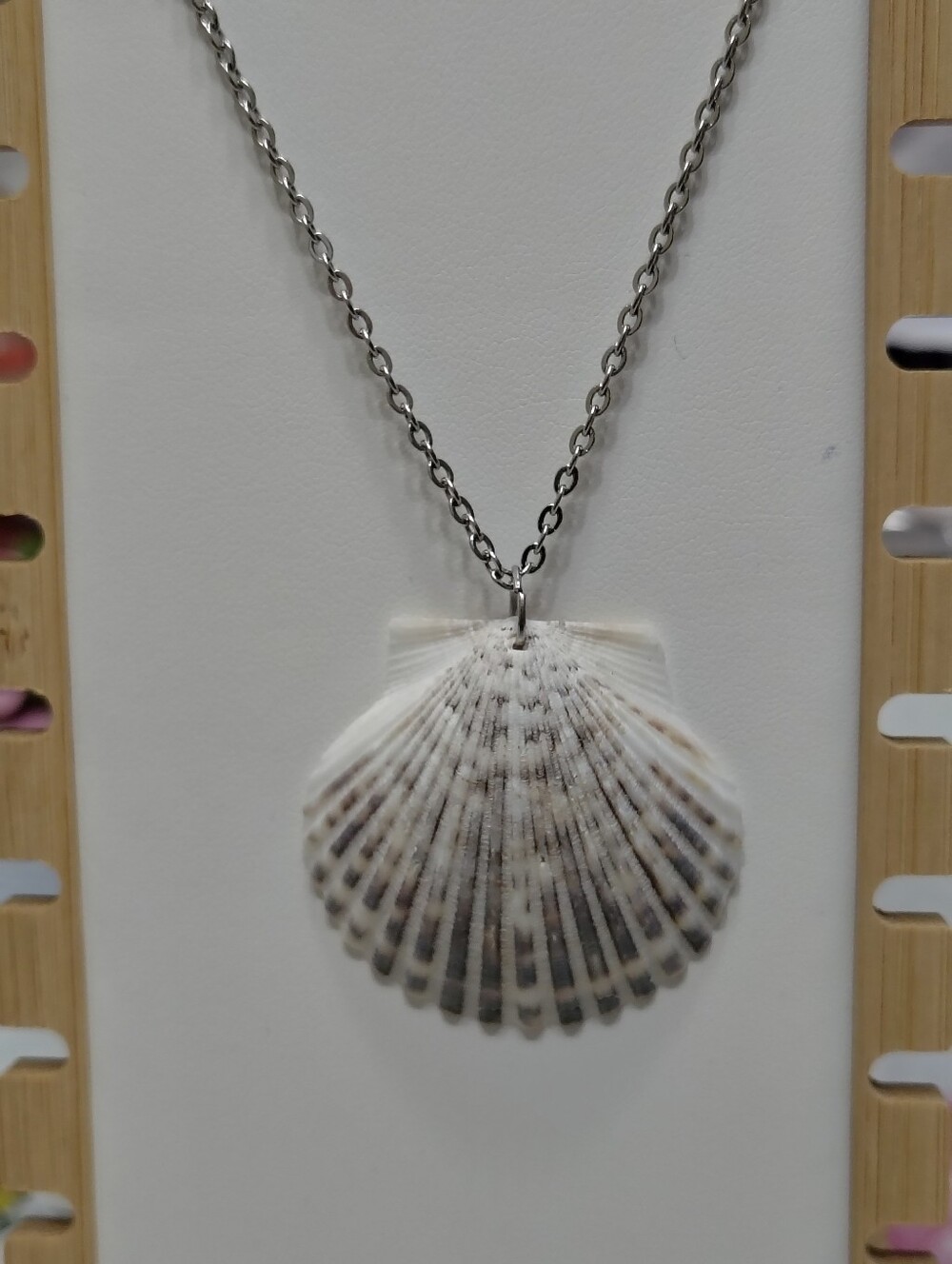 Handcrafted scallop shell necklace left in its natural state